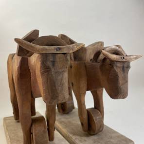 A Pair of Carved Wooden Cows